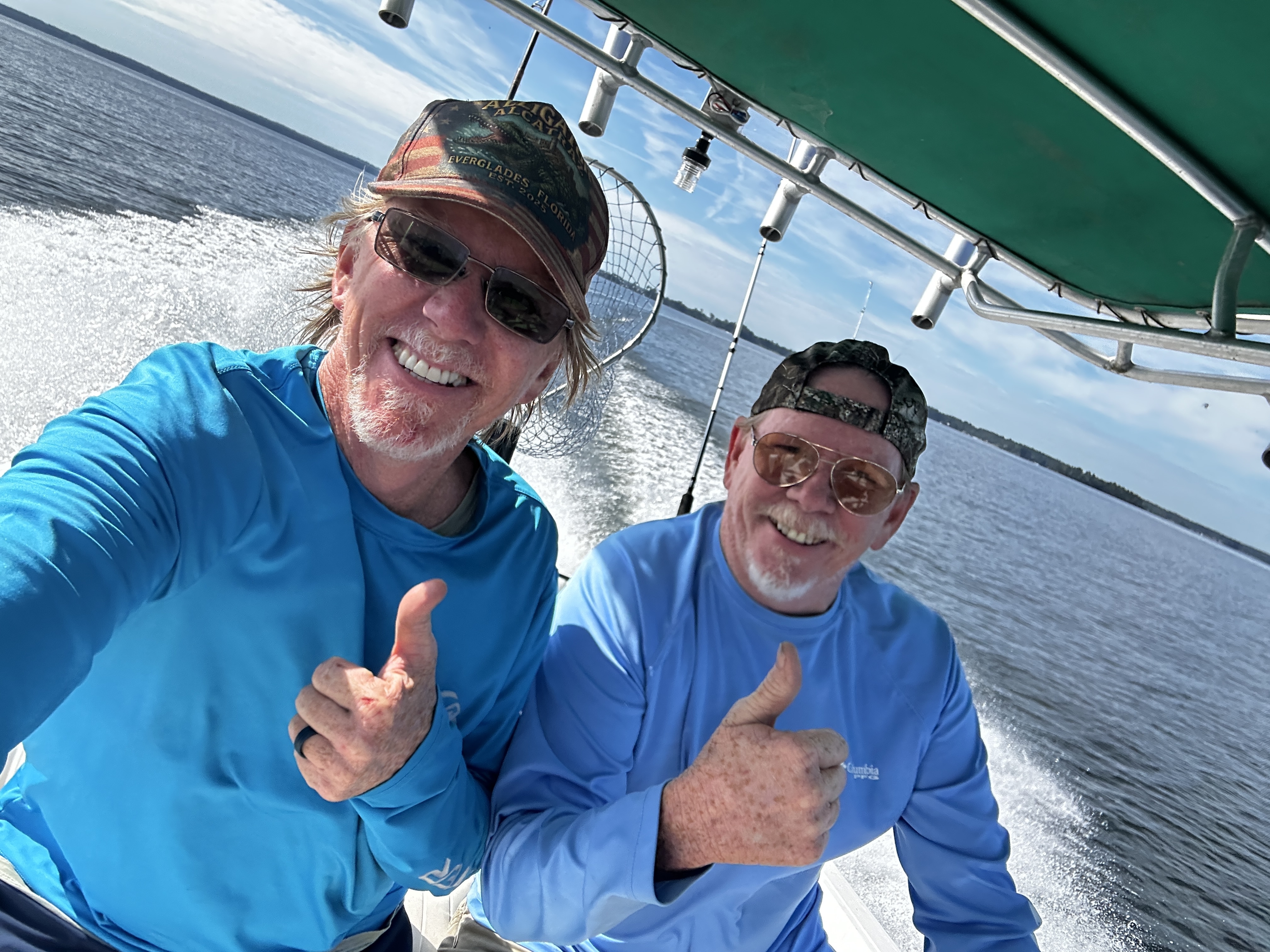 Two anglers fishing from a boat