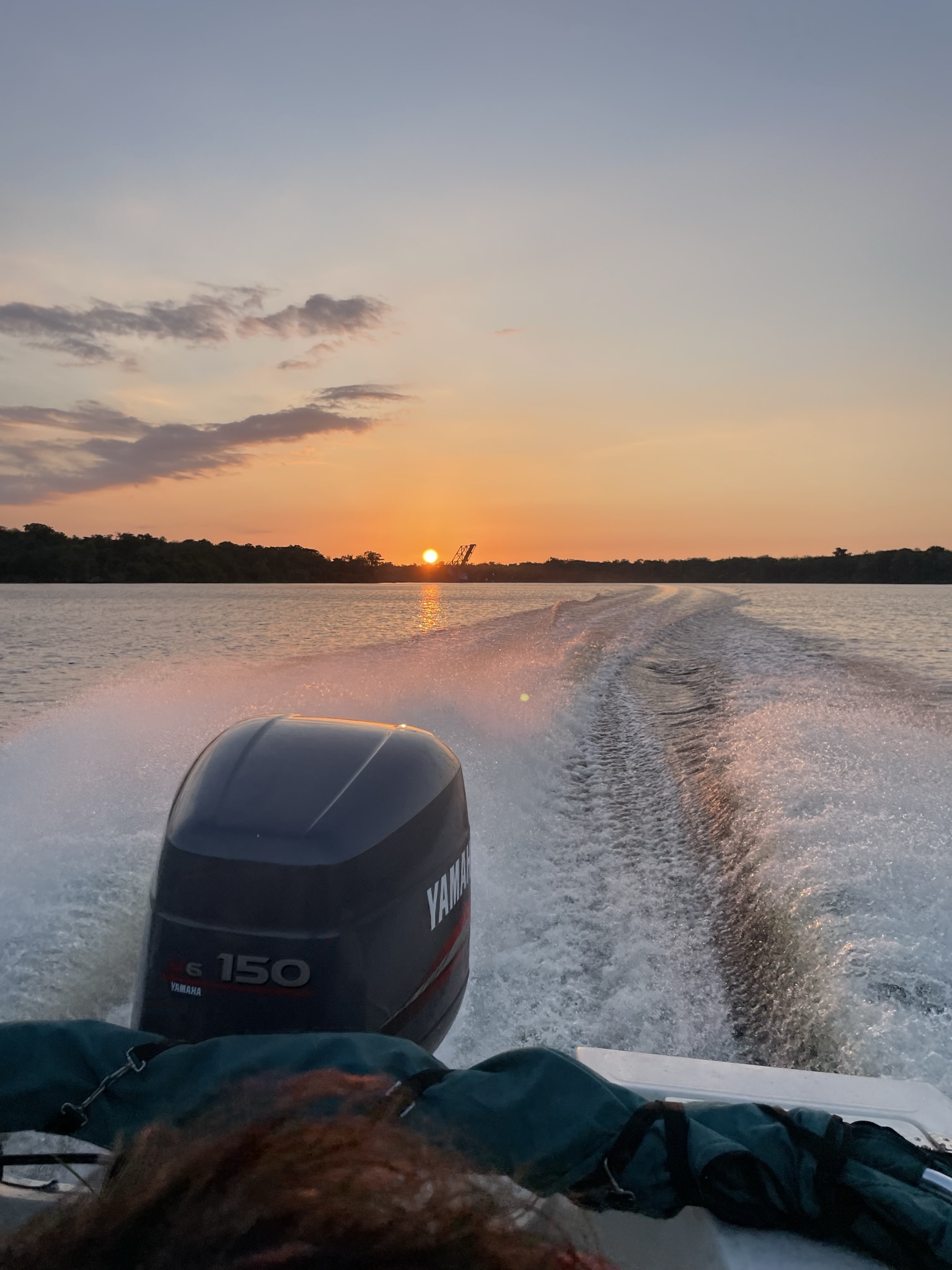 Boat wake at sunset