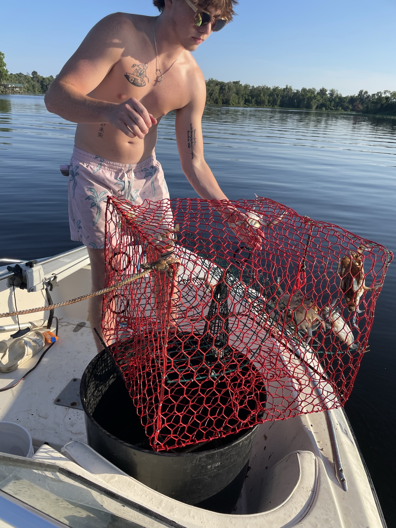 Crab trap with red net on boat